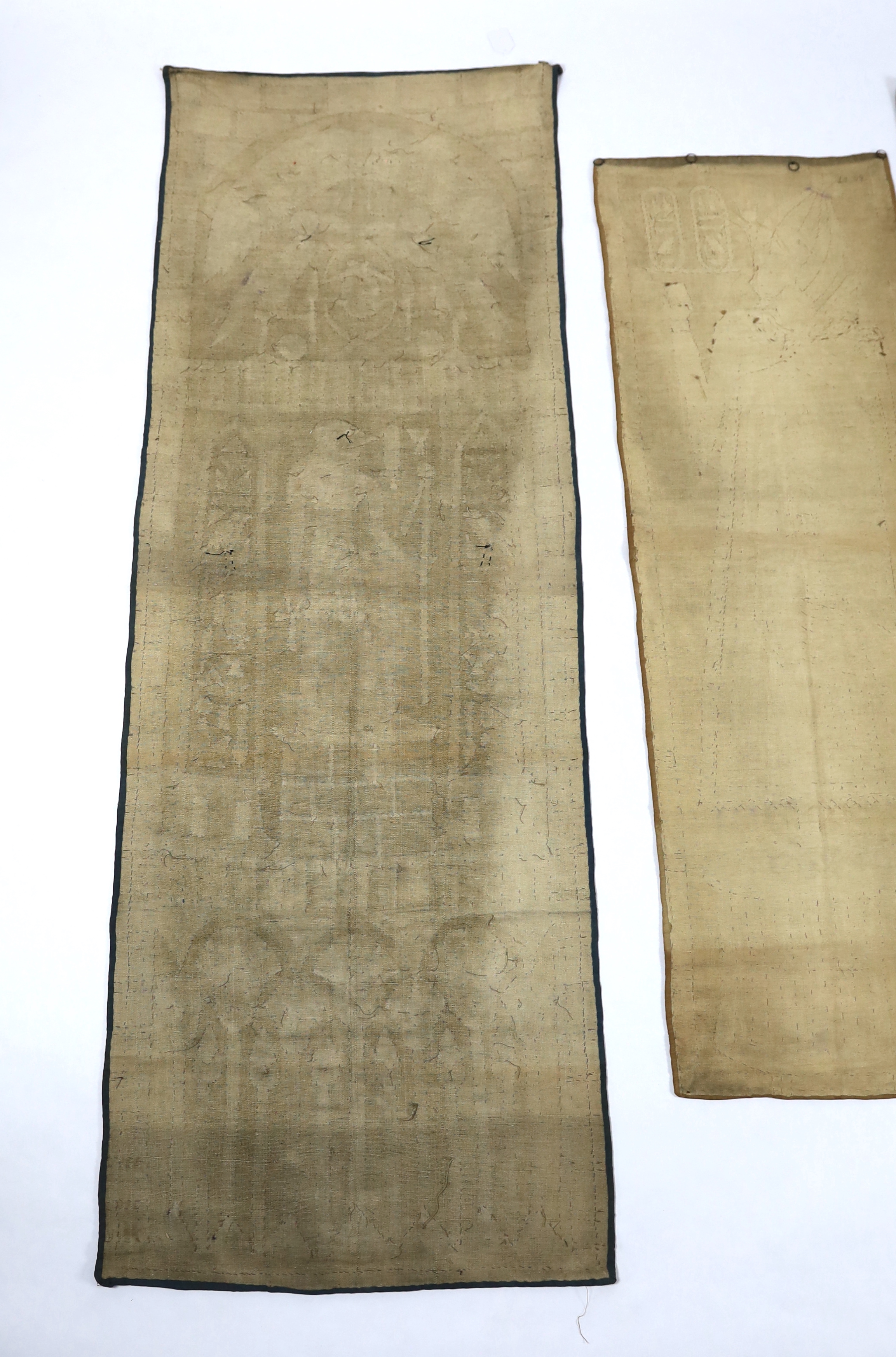 Four 1930’s Egyptian appliqué wall panels, (a pair and two single panels), decorated with various hieroglyphs, Gods and Pharaohs, the panels made for the European market experiencing an Egyptian revival after the discove